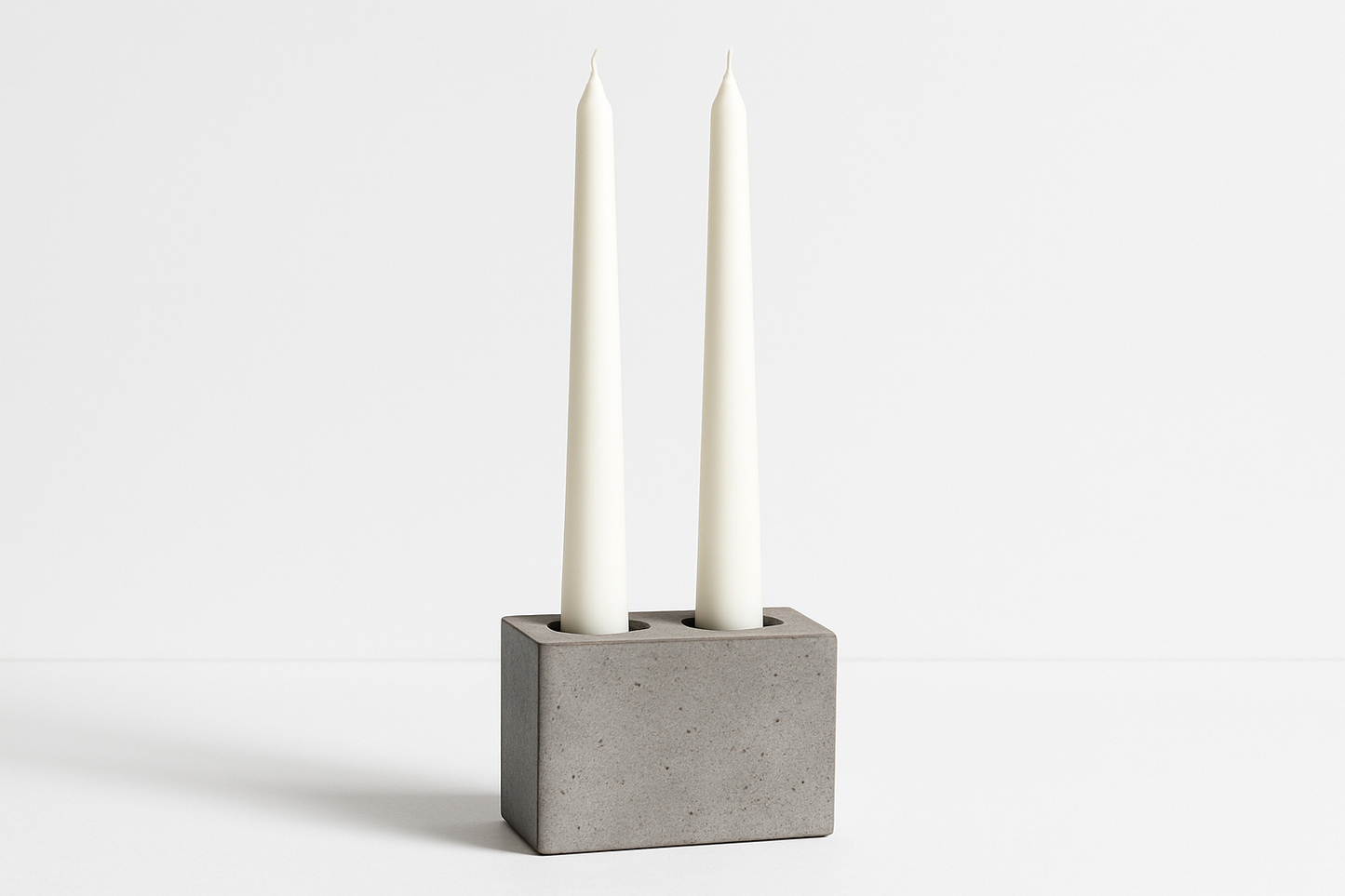 Another shot of candles upright in a cement holder